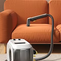 Vacuum Cleaner With Hose Cleaning Orange Sofa Upholstery Surface Smoothly At Home