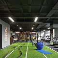 Modern Gym Interior With Multiple Fitness Machines And Seating Area
