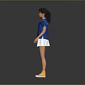 Woman in Blue Top and White Pleated Skirt with Yellow Sneakers Standing