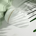 Modern White Toilet Design In Green Interior With Natural Light And Shadow