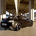 Black Mazda Sports Car Parked Under Concrete Bridge With Scenic Mountain View