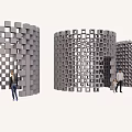 Fitness Enthusiasts Doing Workouts Around Gray Cube Cylinder Structures With Openings
