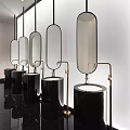 Modern Public Restroom Interior With Black Cylindrical Basins Oval Mirrors And Brass Faucets