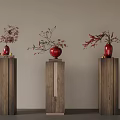 Three Elegant Wooden Pedestals Featuring Red Vases And Flower Branches
