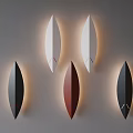 Modern Teardrop Design Wall Lamps In White Black Red With Illuminated Effect On Grey Wall 3d model