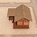 Traditional Thatched House with Wooden Structure and Thatch Roof on Sandy Ground