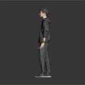 Child Standing In Dark Hoodie And Dark Pants Against Grey Background