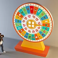 Person Taking Photo of Lucky Draw Wheel With Colorful Icons and Yellow Base
