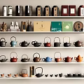Variety of Tea Sets Display with Colorful Teapots Cups and Tea Canisters on Shelves