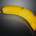 Yellow Banana With Brown Spots On Black Background And Reflected Surface