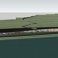 Modern Visitor Center with Lake Reflection and Scenic Grassland Near Hills Under Cloudy Sky