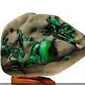 Natural Stone with Green Accents Placed on Wooden Decorative Display Base