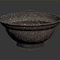 Intricately Carved Metallic Bowl With Detailed Patterns And Smooth Surface Design