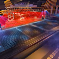 Grand Conference Venue With Red Stage Film Elements And Seats