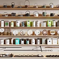 Various Ceramic Tea Wares Display on Wooden Shelves with Teapots Cups and Canisters