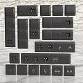 Black Electrical Switch Panels With Various Designs Sockets And Different Switch Configurations