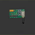 Electronic Green Circuit Board Module With Orange Square Component Blue Chip Long Black Antenna