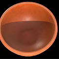 Orange Ceramic Bowl With Ancient Figural Carvings And Decorative Patterns As Household Item