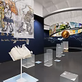 Art Exhibition Space With Large Mural Sculptures And Book Shaped Installations