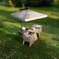 Outdoor Table and Chair Set with Umbrella and Flowers in Green Grass Garden