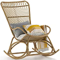 Cozy Rattan Rocking Leisure Chair With Gray And Yellow Cushions And Striped Throw Blanket