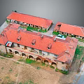 Traditional Connected Buildings With Red Roofs Arched Walkways And Courtyard Space