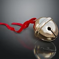 Golden Bell Ornament with Red Ribbon on Dark Background and Shiny Reflection