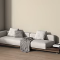 Light Gray Sectional Sofa With Pillows Blanket And Wooden Side Table 3d model