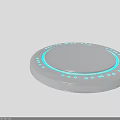 Round Silver Device With Blue LED Lights And Circular Platform Design