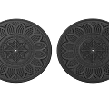Two Black Decorative Lamp Plates With Intricate Floral Patterns And Central Design