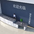 Modern Reception Desk With Marble Top And Potted Plant In Blue Welcome Area