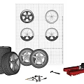 Stacked Car Tires With Wheel Rims On Wall And Repair Tools