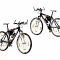 Two Black Giant Mountain Bicycles With Yellow Accents On Tires And White Seats