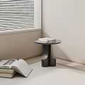 Modern Dark Side Table Design With Stacked Books In Living Corner 3d model