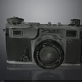 Vintage Silver And Black Electronic Camera With Lens And Knobs