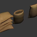 Brown Fabric Bags And Stacked Pillows In Various Shapes On Gray Background