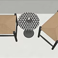 Two Woven Stools with Black Wooden Frames and Round Black and White Geometric Pattern Table