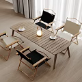 Simple Wooden Dining Table Set With Black Beige Folding Chairs Coffee Cups And Lamp