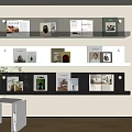 Modern Black And White Wall Mounted Bookcase With Multiple Shelves And Decorative Books