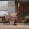 Two Patterned Accent Chairs With Wooden Legs And Small Round Table By Wooden Wall