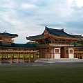 Ancient Wooden Architecture With Black Overhanging Eaves Green Grassland And Trees Under Cloudy Sky