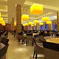 Spacious Banquet Hall Interior With Yellow Pendant Lights Columns Dining Tables And Chairs