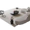 Cream Curved Sofa And Black Round Coffee Table Set With Chair Lamp On Soft Rug