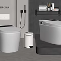 Modern POLIFORM Bathroom With Two White Toilets Trash Can And Shelf With Towels