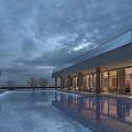Modern Swimming Pool with Glass Railings People Poolside Dusk Sky and Water Reflections