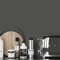 Modern Kitchen Utensils Featuring Wooden Cutting Board Spice Bottles And Silver Toaster