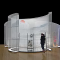 Modern Transparent Curved Exhibition Display With Person Standing And Elements 3d model