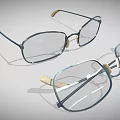 Two Pairs of Stylish Eyeglasses With Metal Frames And Transparent Lenses
