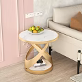 Round Coffee Table With Marble Top Gold Cross Base And Fruit Bowl By Beige Sofa