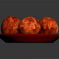 Appetizing Four Baked Meatballs Served on Red Plate with Fresh Green Leaf